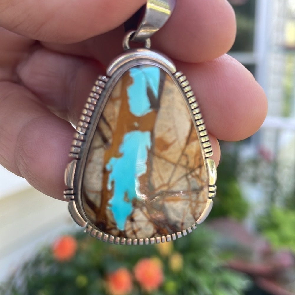 Turquoise silver pendant. Very unusual very organic looking.